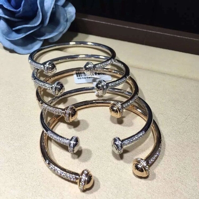 PIAGET  brand  jewelry 18k gold Possession open bangle bracelet set with 90 brilliant-cut diamonds (approx. 1.00 ct).