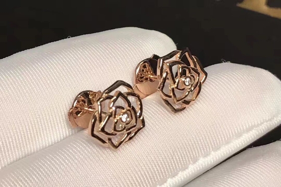 Piaget brand jewelry 18kt  Rose earrings in 18K rose gold set with 2 brilliant-cut diamonds (approx. 0.01 ct).