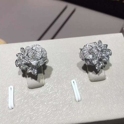 Piaget brand jewelry 18kt  Piaget Rose earrings in 18K white gold set with 72 brilliant-cut diamonds (approx. 0.45 ct).
